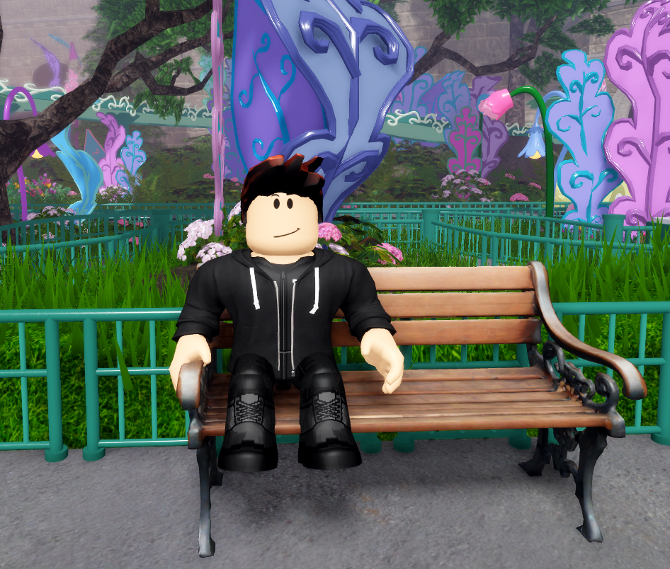 a cool ass dude sitting on a bench